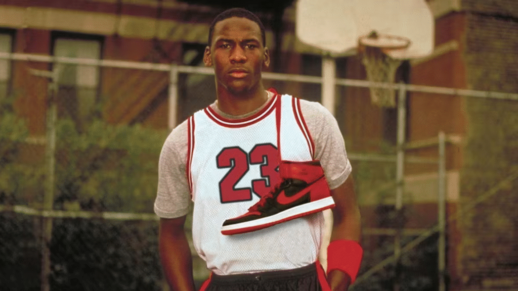 Michael Jordan smiling with Nike Air Jordan sneakers draped around his neck, symbolizing his iconic athlete endorsement deal with Nike.