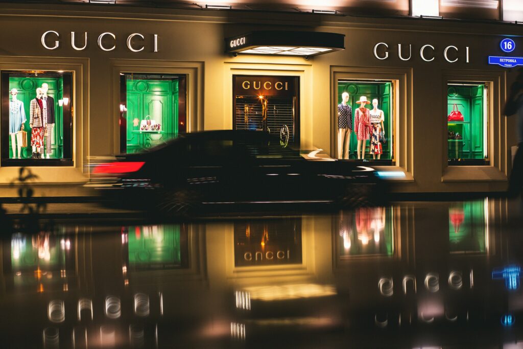 The luxurious exterior of a Gucci showroom, showcasing elegant architecture and sophisticated branding, symbolizing the exclusive retail presence of luxury brands in the high fashion industry.