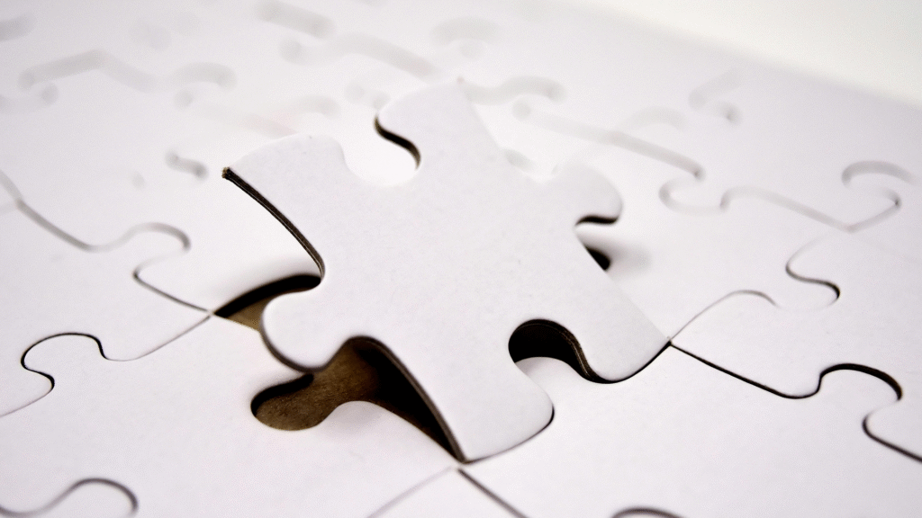 Two distinct puzzle pieces, one representing a product and the other a market or customer need, perfectly interlocked, symbolizing the crucial alignment of market fit for startup success.