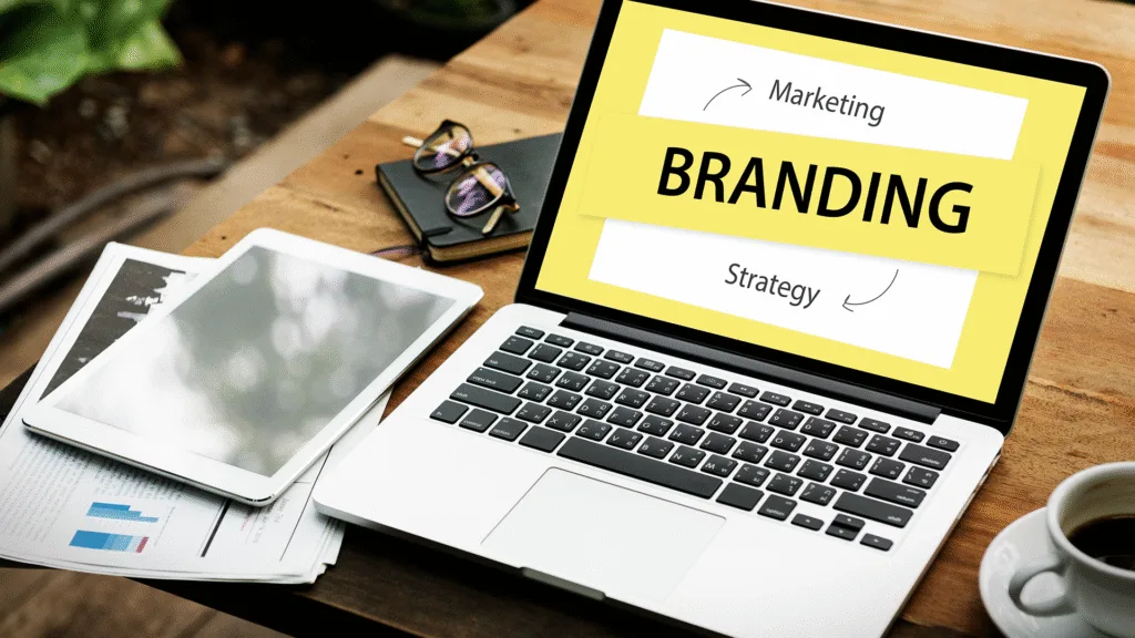 Desk with branding strategy documents and marketing materials illustrating branding and marketing concepts.