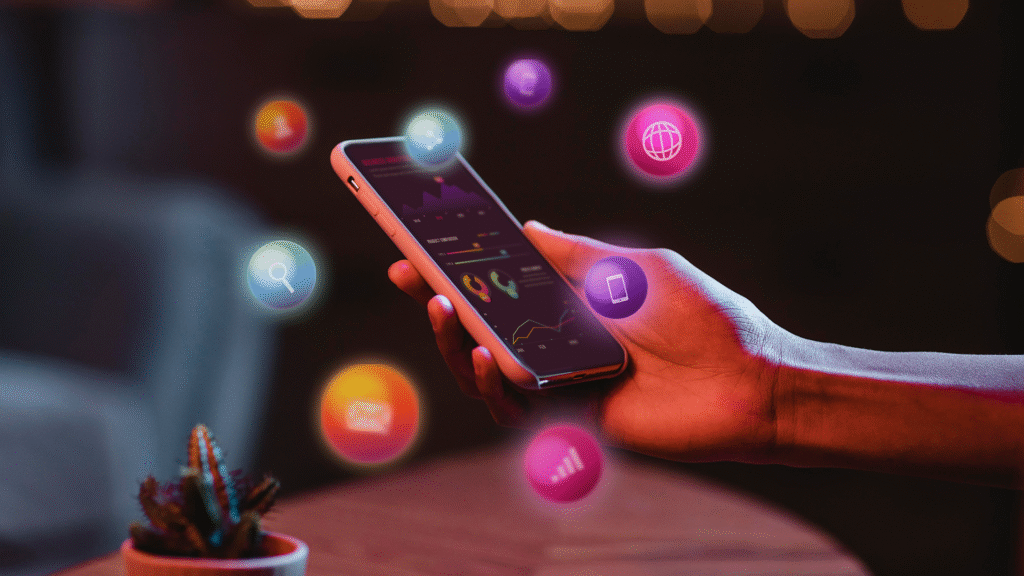 Person holding a smartphone surrounded by floating social media icons representing viral marketing and online sharing.