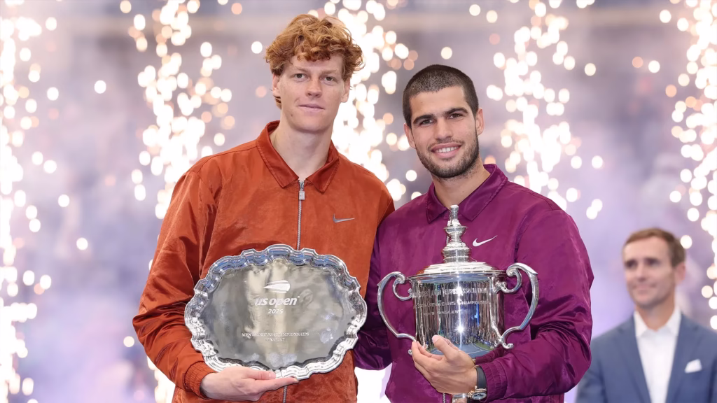 US Open champion and runner-up with trophies representing tennis player salaries and Grand Slam prize money disparity