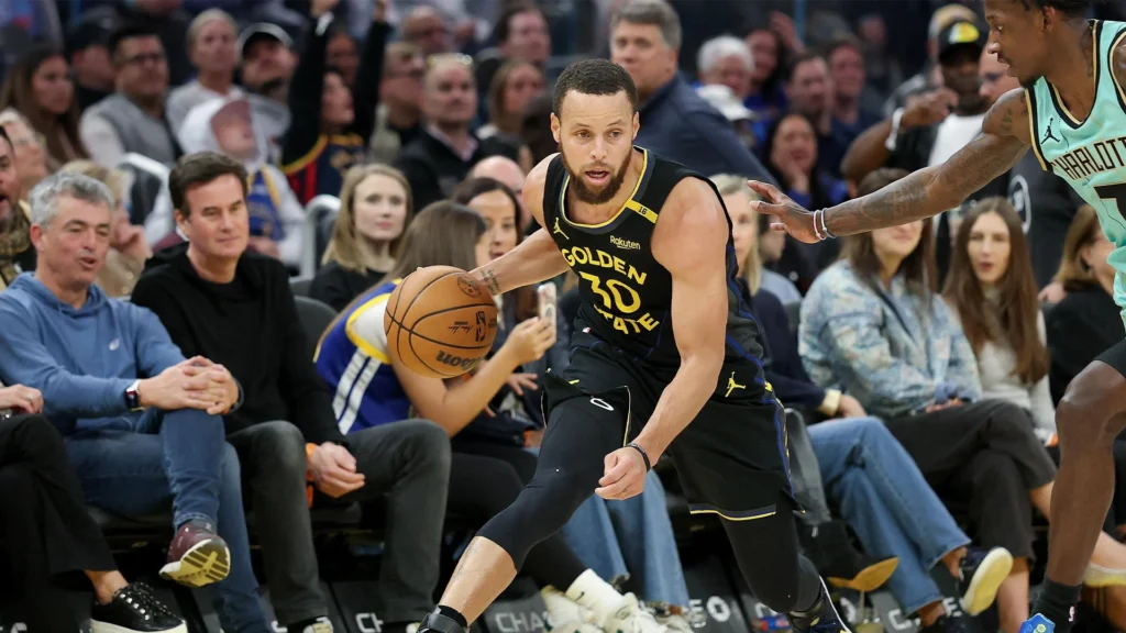 Stephen Curry playing for Golden State Warriors at Chase Center representing NBA team valuations reaching $5.51 billion average with Warriors worth $11.33 billion highest in league driven by arena ownership and championship success