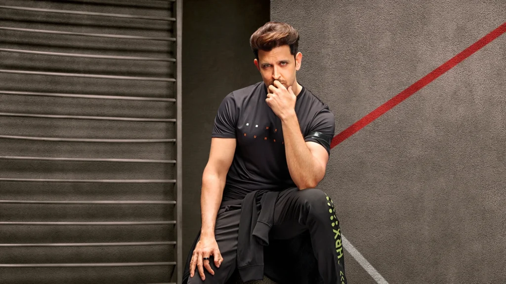 Hrithik Roshan wearing HRX fitness brand athleisure collection black workout wear showcasing India's leading homegrown sportswear brand that generates over 200 crore annual revenue through Myntra partnership and Cult.fit integration