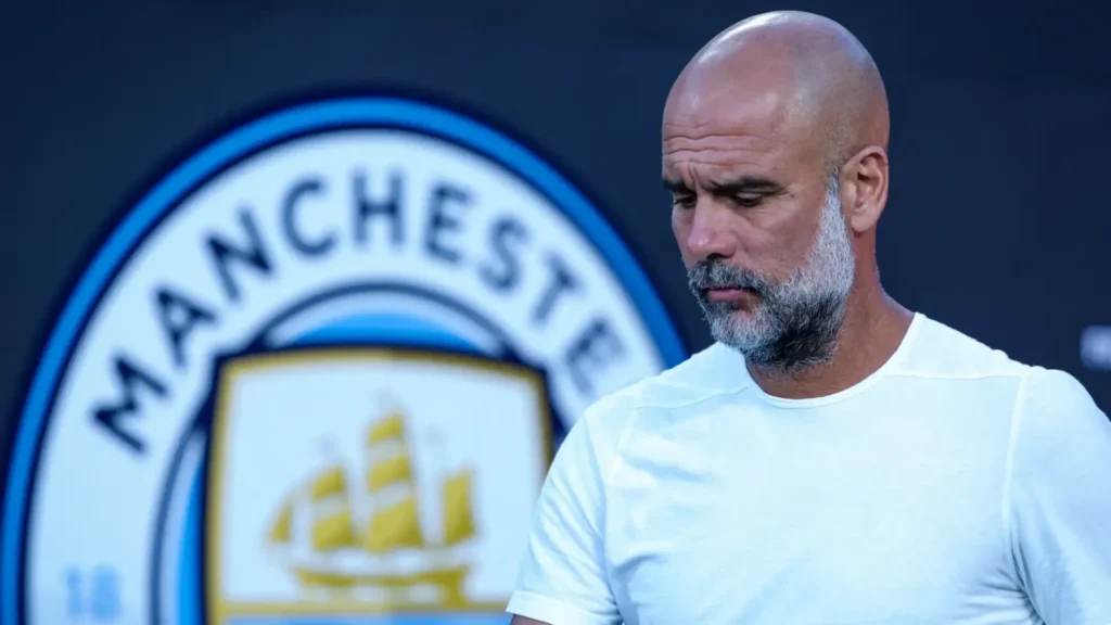 Pep Guardiola looking concerned in front of Manchester City logo representing 115 Premier League charges for financial fair play violations facing potential relegation points deduction and end of four consecutive title era