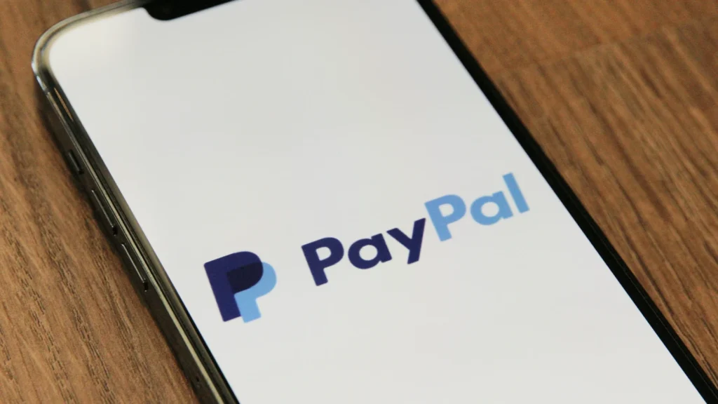 PayPal logo displayed on smartphone screen representing the digital payment platform that processes $1.68 trillion annually through 436 million active accounts