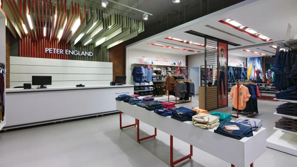 Peter England store interior displaying affordable formal wear with organized shirt displays and professional retail layout for middle-class consumers