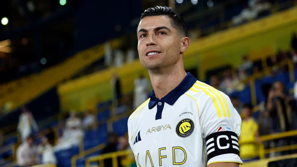 Cristiano Ronaldo celebrates goal for Al-Nassr in yellow jersey Saudi Pro League 677 million dollar contract 15 percent ownership stake