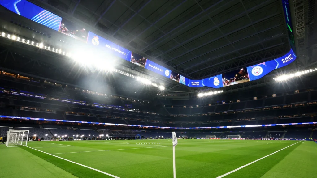 Santiago Bernabeu Stadium interior showing 360-degree LED screen retractable roof and pitch representing Real Madrid venue generating €400 million annual revenue after €1.347 billion renovation completed 2024