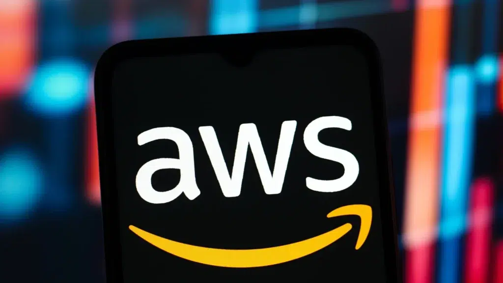 AWS logo displayed on smartphone screen with Amazon smile icon and colorful blurred background