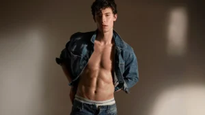 Shawn Mendes posing confidently in Calvin Klein underwear campaign photoshoot showcasing viral marketing success