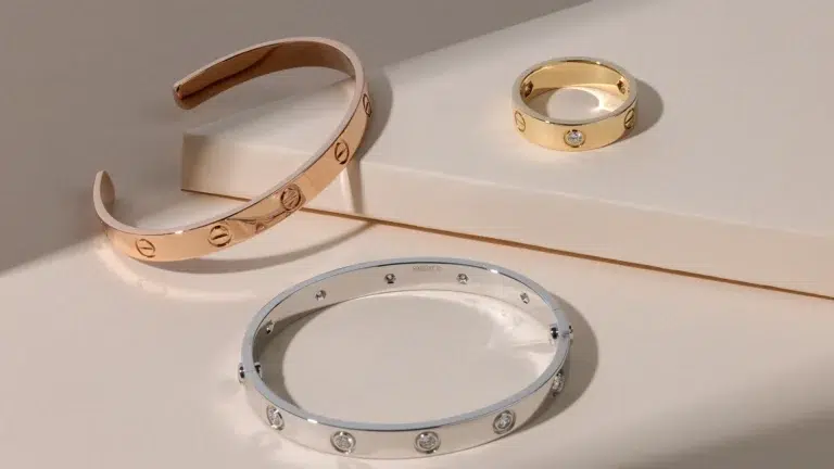 Cartier Love bracelet collection in rose gold, white gold, and yellow gold with signature screw motif showing iconic jewelry design strategy