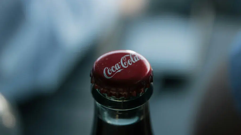 Close-up of Coca-Cola bottle cap with brand logo