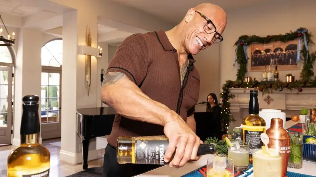 Dwayne Johnson The Rock pouring Teremana Tequila showing the fastest-growing celebrity tequila brand valued at $3.5 billion