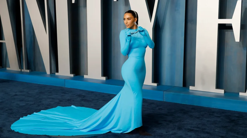 Kim Kardashian in iconic electric blue Balenciaga gown with matching gloves at Vanity Fair Oscars afterparty 2022