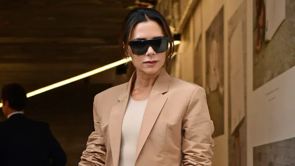 Victoria Beckham standing in her fashion label showroom showcasing the brand that went from £66M in losses to £112M revenue