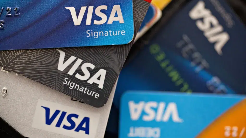 Close-up of Visa credit cards showing brand logo and contactless payment symbol