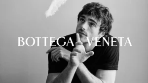 Jacob Elordi in black and white Bottega Veneta campaign striking artistic pose showcasing quiet luxury aesthetic