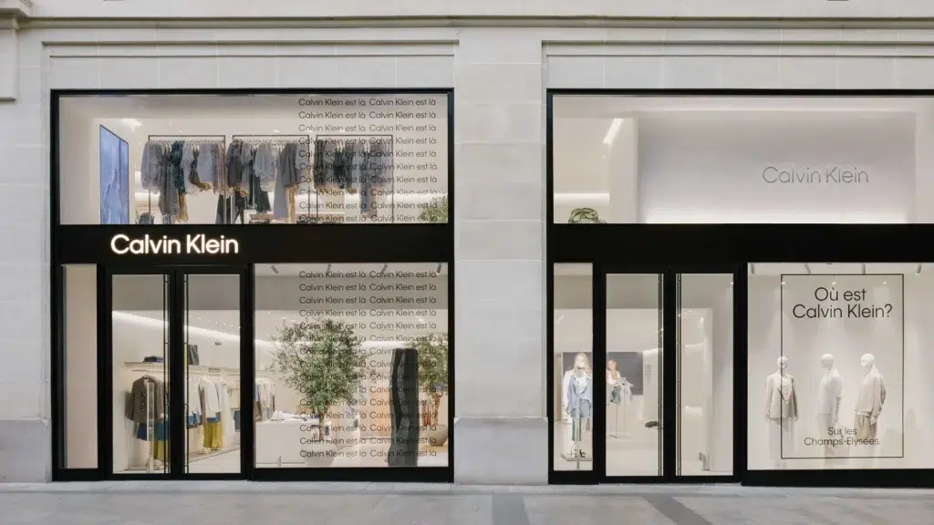 Calvin Klein store front with clean minimalist branding and signature white interiors representing the brand's iconic aesthetic