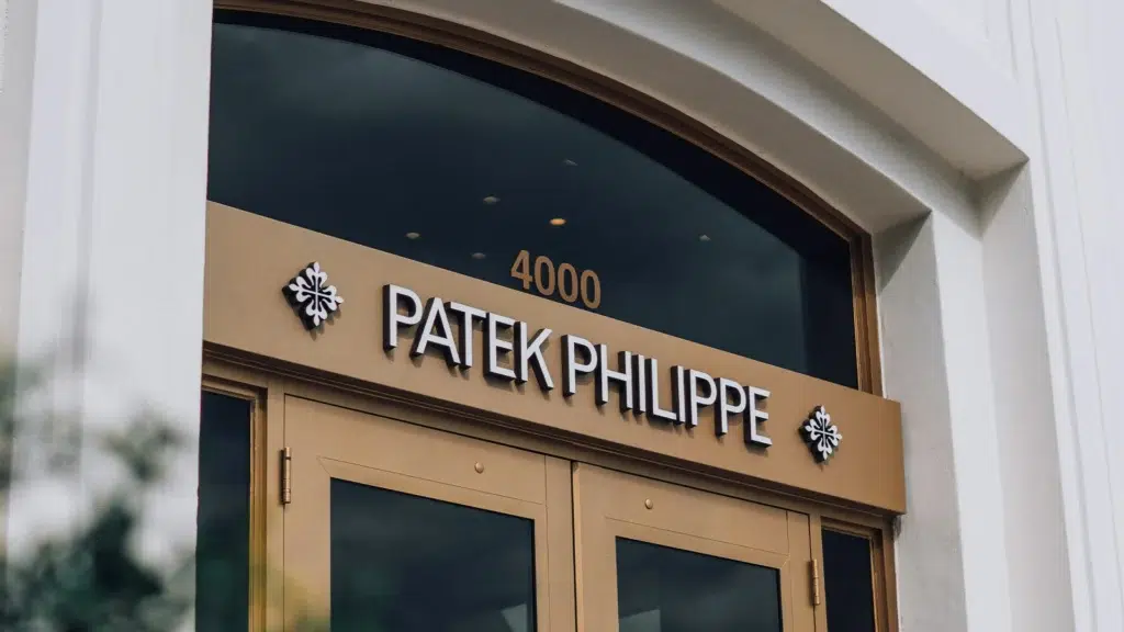 Patek Philippe boutique entrance with gold signage showing luxury watchmaking heritage and exclusivity