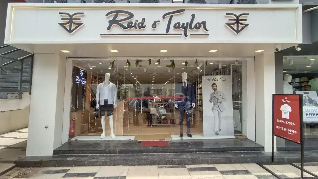 Reid & Taylor store front in India with brand signage showing premium menswear suiting heritage and retail expansion
