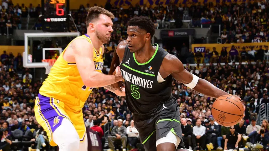 Anthony Edwards Minnesota Timberwolves drives past Luka Doncic Los Angeles Lakers NBA player power economics supermax contracts
