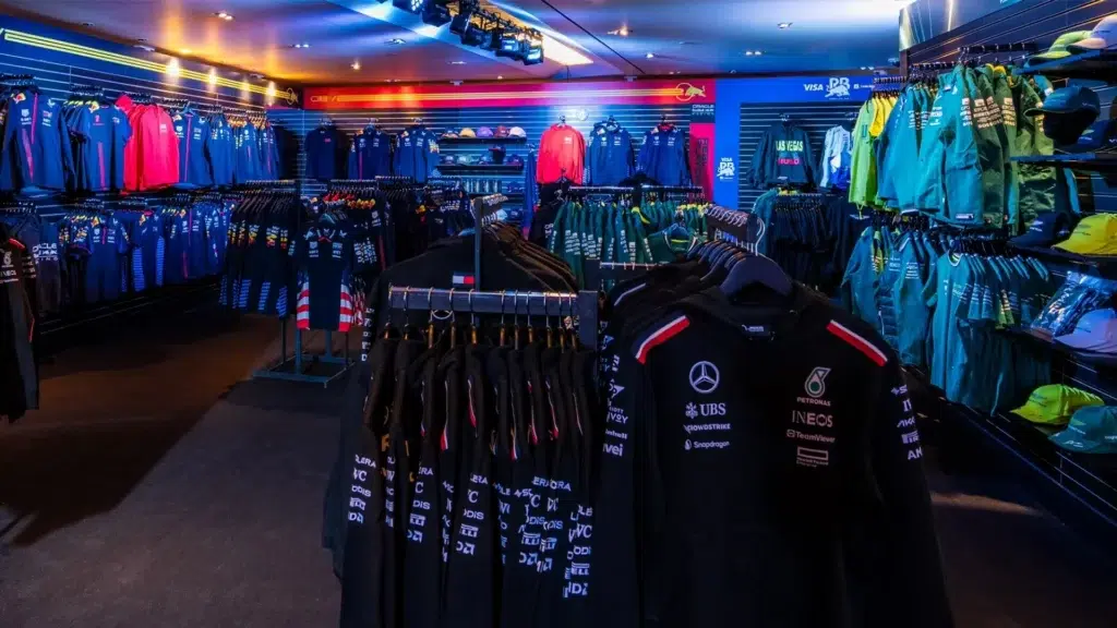F1 team merchandise store Tommy Hilfiger Cadillac luxury fashion Puma Ferrari teamwear 2026