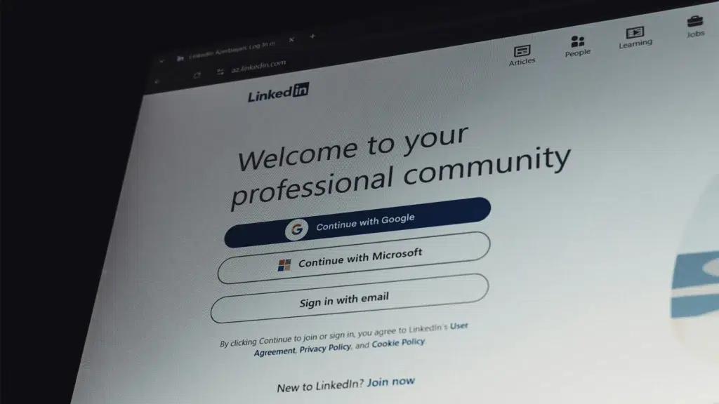 LinkedIn login page on laptop screen showing professional community network Microsoft acquisition strategy