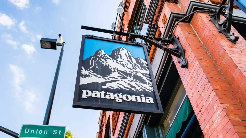 Patagonia store sign on brick building representing the brand's environmental mission and anti-consumption strategy