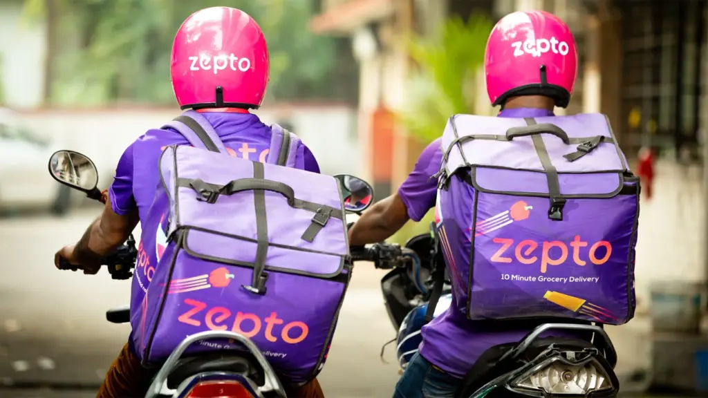 Zepto delivery riders on motorcycles with purple helmets and backpacks representing India's fastest-growing quick commerce platform